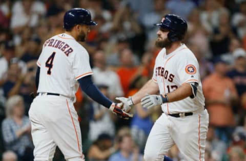 HOUSTON, TX – JULY 11: Tyler White #13 of the Houston Astros receives congratulations from George Springer #4 after hitting a home run in the fifth inning against the Oakland Athletics at Minute Maid Park on July 11, 2018 in Houston, Texas. (Photo by Bob Levey/Getty Images)