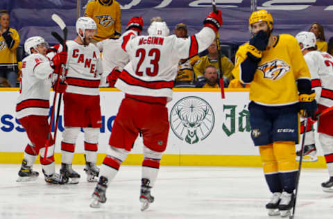 NASHVILLE, TENNESSEE – MAY 27: Teuvo Teravainen #86, Jaccob Slavin #74, and Brock McGinn #23 of the Carolina Hurricanes celebrate after scoring a goal during overtime for a 4-3 victory over the Nashville Predators in Game Six of the First Round of the 2021 Stanley Cup Playoffs at Bridgestone Arena on May 27, 2021, in Nashville, Tennessee. (Photo by Frederick Breedon/Getty Images)