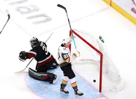 Darcy Kuemper #35 of the Arizona Coyotes is unable to stop a power play goal by Reilly Smith of the Vegas Golden Knights as Nick Cousins #21 of the Vegas Golden Knights celebrates. (Photo by Jeff Vinnick/Getty Images)