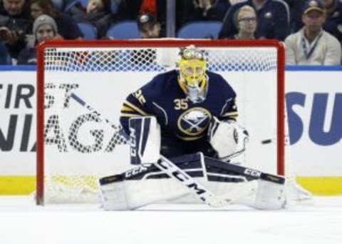 Dec 31, 2015; Buffalo, NY, USA; Buffalo Sabres goalie Linus Ullmark (35) looks to make a save during the second period against the New York Islanders at First Niagara Center. Mandatory Credit: Timothy T. Ludwig-USA TODAY Sports