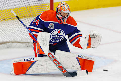 Oct 26, 2023; Edmonton, Alberta, CAN; Edmonton Oilers goaltender Stuart Skinner (74) makes a save during warmup against the New York Rangers at Rogers Place. Mandatory Credit: Perry Nelson-USA TODAY Sports