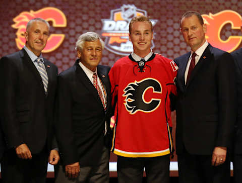 Jun 27, 2014; Philadelphia, PA, USA; Samuel Bennett poses for a photo with team officials after being selected as the number four overall pick to the Calgary Flames in the first round of the 2014 NHL Draft at Wells Fargo Center. Mandatory Credit: Bill Streicher-USA TODAY Sports