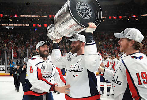 LAS VEGAS, NV – JUNE 07: Alex Ovechkin #8 and Nicklas Backstrom #19 of the Washington Capitals watch as teammate Brooks Orpik #44 celebrates with the Stanley Cup after their team defeated the Vegas Golden Knights 4-3 in Game Five of the 2018 NHL Stanley Cup Final at T-Mobile Arena on June 7, 2018 in Las Vegas, Nevada. The Capitals won the series four games to one. (Photo by Dave Sandford/NHLI via Getty Images)