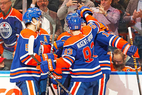 Dec 6, 2023; Edmonton, Alberta, CAN; The Edmonton Oilers celebrate a goal scored by forward Zach Hyman (18), his third goal of the game against the Carolina Hurricanes at Rogers Place. Mandatory Credit: Perry Nelson-USA TODAY Sports