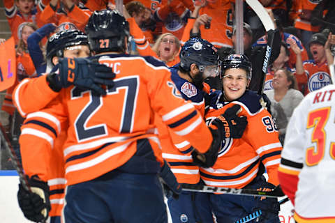 EDMONTON, AB – JANUARY 19: Jesse Puljujarvi #98, Jujhar Khaira #16, Milan Lucic #27 and Matthew Benning #83 of the Edmonton Oilers celebrate after a goal during the game against the Calgary Flames on January 19, 2019 at Rogers Place in Edmonton, Alberta, Canada. (Photo by Andy Devlin/NHLI via Getty Images)