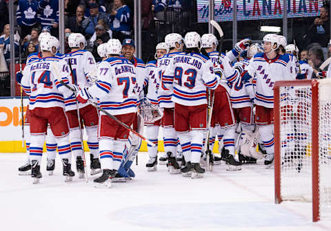 TORONTO, ON – DECEMBER 28: New York Rangers defenseman Tony DeAngelo (77)) celebrates the win in the overtime period with New York Rangers goaltender Henrik Lundqvist (30) on December 28, 2019, at Scotiabank Arena in Toronto, Ontario Canada.(Photo by Nick Turchiaro/Icon Sportswire via Getty Images)