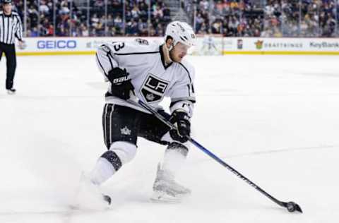 Feb 21, 2017; Denver, CO, USA; Los Angeles Kings left wing Kyle Clifford (13) controls the puck in the first period against the Colorado Avalanche at the Pepsi Center. Mandatory Credit: Isaiah J. Downing-USA TODAY Sports