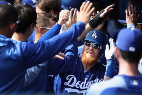 GLENDALE, ARIZONA – FEBRUARY 25: Jusstin Turner #10 of the Los Angeles Dodgers high fives teammates in the dugout after hitting a two-run home run against the Chicago Cubs during the first inning of the MLB spring training game at Camelback Ranch on February 25, 2019 in Glendale, Arizona. (Photo by Chrristian Petersen/Getty Images)