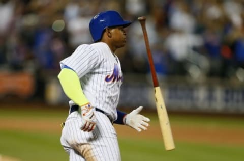 Sep 21, 2016; New York City, NY, USA; New York Mets left fielder Yoenis Cespedes (52) reacts after Atlanta Braves center fielder Ender Inciarte (11) caught a ball he hit in the ninth inning at Citi Field. Mandatory Credit: Noah K. Murray-USA TODAY Sports