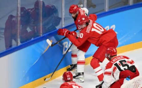 Denmark’s Markus Lauridsen (22) and Russian Olympic Committee’s Dmitrii Voronkov vie for the puck during the men’s play-off quarterfinal match of the Beijing 2022 Winter Olympic Games ice hockey competition between the Russian Olympic Committee and Denmark, at the Wukesong Sports Centre in Beijing on February 16, 2022. (Photo by Kirill KUDRYAVTSEV / AFP) (Photo by KIRILL KUDRYAVTSEV/AFP via Getty Images)