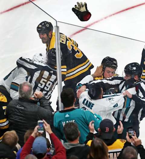 BOSTON – OCTOBER 29: Fists and gloves fly in the third period as the Bruins’ Zdeno Chara (33) fights the Sharks’ Branden Dillon, while Boston’s Charlie McAvoy (73) does the same with San Jose’s Evander Kane at right. The Boston Bruins host the San Jose Sharks in a regular season NHL hockey game at TD Garden in Boston on Oct. 29, 2019. (Photo by Jim Davis/The Boston Globe via Getty Images)