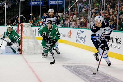 DALLAS, TX – OCTOBER 06: Winnipeg Jets center Mark Scheifele (55) looks tp pass the puck during the game between the Dallas Stars and the Winnipeg Jets on October 6, 2018 at the American Airlines Center in Dallas, Texas. Dallas defeats Winnipeg 5-1. (Photo by Matthew Pearce/Icon Sportswire via Getty Images)