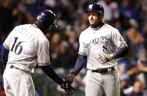 Apr 17, 2017; Chicago, IL, USA; Milwaukee Brewers left fielder Ryan Braun (8) celebrates with right fielder Domingo Santana (16) after scoring during the game against the Chicago Cubs at Wrigley Field. Mandatory Credit: Caylor Arnold-USA TODAY Sports