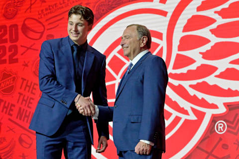 Jul 7, 2022; Montreal, Quebec, CANADA; Marco Kasper shakes hands with NHL commissioner Gary Bettman after being selected as the number eight overall pick to the Detroit Red Wings in the first round of the 2022 NHL Draft at Bell Centre. Mandatory Credit: Eric Bolte-USA TODAY Sports