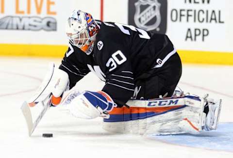 Feb 2, 2016; Brooklyn, NY, USA; New York Islanders goalie Jean-Francois Berube (30) makes a save against the Minnesota Wild during the first period at Barclays Center. Mandatory Credit: Brad Penner-USA TODAY Sports