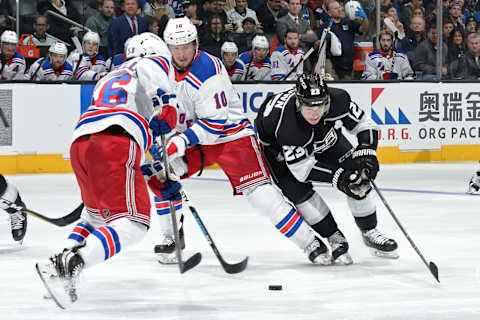 LOS ANGELES, CA – JANUARY 21: Dustin Brown #23 of the Los Angeles Kings battles for the puck against J.T. Miller #10 and Mats Zuccarello #36 of the New York Rangers at STAPLES Center on January 21, 2018 in Los Angeles, California. (Photo by Adam Pantozzi/NHLI via Getty Images)