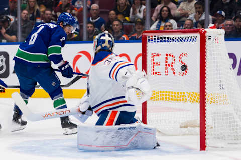 Oct 11, 2023; Vancouver, British Columbia, CAN; Edmonton Oilers defenseman Brett Kulak (27) watches as Vancouver Canucks forward Conor Garland (8) scores on goalie Jack Campbell (36) in the first period at Rogers Arena. Mandatory Credit: Bob Frid-USA TODAY Sports