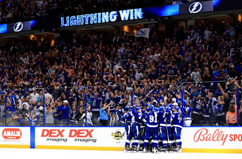 TAMPA, FLORIDA – MAY 12: The Tampa Bay Lightning celebrate winning Game Five of the First Round of the 2022 Stanley Cup Playoffs on a goal by Brayden Point #21 against the Toronto Maple Leafs at Amalie Arena on May 12, 2022 in Tampa, Florida. (Photo by Mike Ehrmann/Getty Images)