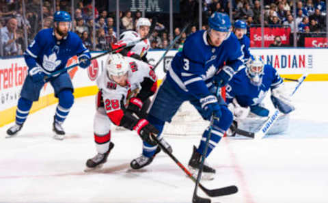 TORONTO, ON – FEBRUARY 1: Connor Brown #28 of the Ottawa Senators battles for the puck against Justin Holl #3 of the Toronto Maple Leafs during the first period at the Scotiabank Arena on February 1, 2020 in Toronto, Ontario, Canada. (Photo by Kevin Sousa/NHLI via Getty Images)