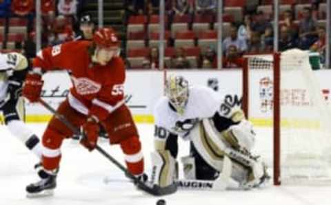 Sep 24, 2015; Detroit, MI, USA; Detroit Red Wings left wing Tyler Bertuzzi (59) tries to score on Pittsburgh Penguins goalie Matthew Murray (30) in the first period at Joe Louis Arena. Mandatory Credit: Rick Osentoski-USA TODAY Sports