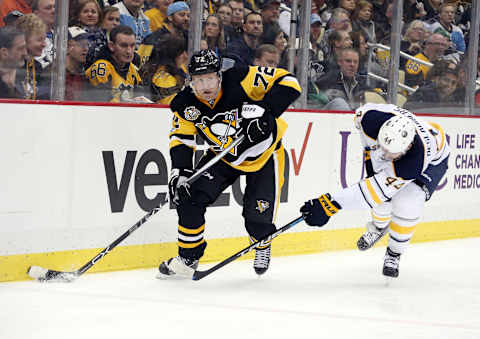 Mar 5, 2017; Pittsburgh, PA, USA; Pittsburgh Penguins right wing Patric Hornqvist (72) moves the puck ahead of Buffalo Sabres left wing Nicolas Deslauriers (44) during the third period at the PPG PAINTS Arena. The Penguins won 4-3. Mandatory Credit: Charles LeClaire-USA TODAY Sports