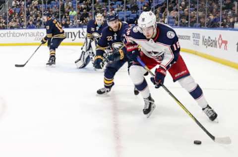 BUFFALO, NY – JANUARY 11: Columbus Blue Jackets Center Pierre-Luc Dubois (18) skates with the puck as Buffalo Sabres Left Wing Johan Larsson (22) defends during the Columbus Blue Jackets and Buffalo Sabres NHL game on January 11, 2018, at KeyBank Center in Buffalo, NY. (Photo by John Crouch/Icon Sportswire via Getty Images)