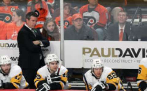 PHILADELPHIA, PA – APRIL 18: Head Coach of the Pittsburgh Penguins Mike Sullivan looks on during the first period behind Bryan Rust #17, Conor Sheary #43 and Carl Hagelin #62 against the Philadelphia Flyers in Game Four of the Eastern Conference First Round during the 2018 NHL Stanley Cup Playoffs at the Wells Fargo Center on April 18, 2018 in Philadelphia, Pennsylvania. (Photo by Len Redkoles/NHLI via Getty Images)