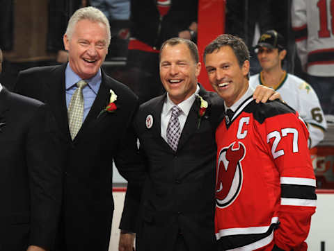 Scott Niedermayer (R) poses with Larry Robinson (L) and Scott Stevens (C) (Photo by Bruce Bennett/Getty Images)