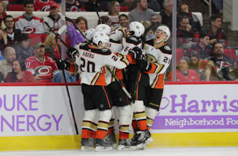 RALEIGH, NC – NOVEMBER 30: Anaheim Ducks center Ryan Getzlaf (15) gets swarmed with hugs from his Anaheim Ducks teammates during the OT of the Carolina Hurricanes game versus the Anaheim Ducks on November 30th, 2018 at PNC Arena in Raleigh, NC. (Photo by Jaylynn Nash/Icon Sportswire via Getty Images)