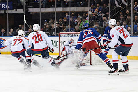 Feb 24, 2022; New York, New York, USA; Washington Capitals goaltender Ilya Samsonov (30) makes a save on a shot by New York Rangers center Morgan Barron (47) in front of right wing T.J. Oshie (77) and center Lars Eller (20) and center Connor McMichael (24) during the first period at Madison Square Garden. Mandatory Credit: Vincent Carchietta-USA TODAY Sports