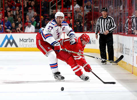 RALEIGH, NC – MARCH 09: Ryan McDonagh #27 of the New York Rangers battles for position on the ice with Lee Stempniak #21 of the Carolina Hurricanes during an NHL game on March 9, 2017 at PNC Arena in Raleigh, North Carolina. (Photo by Gregg Forwerck/NHLI via Getty Images)