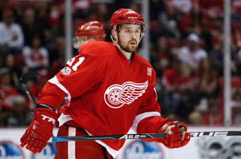 Detroit Red Wings defenseman Xavier Ouellet (61) looks on (Raj Mehta-USA TODAY Sports)