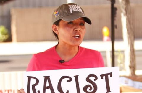 Jun 25, 2014: Amanda Bloackhorse, a Native American protests the use of the Chief Wahoo mascot by the Cleveland Indians Major League Baseball team outside a regular season game between the Cleveland Indians and the Arizona Diamondbacks at Chase Field. (Photo by Doug James/Icon SMI/Corbis via Getty Images)