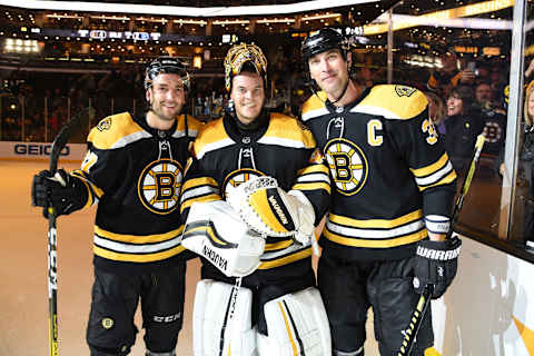 BOSTON, MA – OCTOBER 22: After his 500th NHL game Tuukka Rask #40 of the Boston Bruins poses with teammates Patrice Bergeron #37 and Zdeno Chara #33 after the win against the Toronto Maple Leafs at the TD Garden on October 22, 2019 in Boston, Massachusetts. (Photo by Steve Babineau/NHLI via Getty Images)