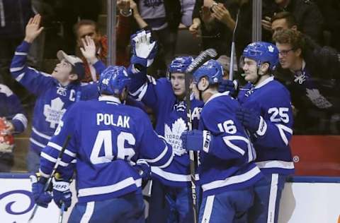 NHL Power Rankings: Toronto Maple Leafs forward Tyler Bozak (middle) celebrates his goal against the Minnesota Wild with Toronto Maple Leafs forward Mitchell Marner (16) and forward James van Riemsdyk (25) and defenseman Roman Polak (46) during the second period at Air Canada Centre. Mandatory Credit: John E. Sokolowski-USA TODAY Sports