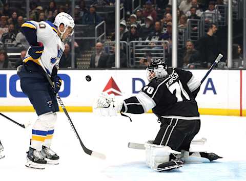 LOS ANGELES, CALIFORNIA – MARCH 04: Joonas Korpisalo #70 of the Los Angeles Kings makes a save in front of Brayden Schenn #10 of the St. Louis Blues during a 4-2 Kings win at Crypto.com Arena on March 04, 2023 in Los Angeles, California. (Photo by Harry How/Getty Images)