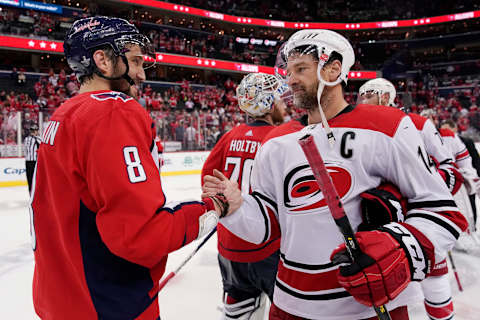 WASHINGTON, DC – APRIL 24: Alex Ovechkin #8 of the Washington Capitals and Justin Williams #14 of the Carolina Hurricanes shake hands after the Hurricanes defeated the Capitals 4-3 in the second overtime period in Game Seven of the Eastern Conference First Round during the 2019 NHL Stanley Cup Playoffs at Capital One Arena on April 24, 2019 in Washington, DC. (Photo by Patrick McDermott/NHLI via Getty Images)