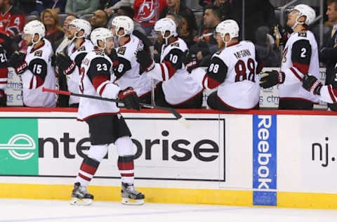 Oct 25, 2016; Newark, NJ, USA; Arizona Coyotes defenseman Oliver Ekman-Larsson (23) celebrates his goal against the New Jersey Devils during the third period at Prudential Center. The Devils defeated the Coyotes 5-3. Mandatory Credit: Ed Mulholland-USA TODAY Sports