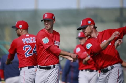 Feb 20, 2016; Lee County, FL, USA; Boston Red Sox starting pitcher Rick Porcello (22), Boston Red Sox starting pitcher David Price (24) and Boston Red Sox relief pitcher Craig Kimbrel (46) stretch as they works out at Jet Blue Park. Mandatory Credit: Kim Klement-USA TODAY Sports