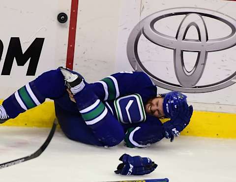 Oct 27, 2015; Vancouver, British Columbia, CAN; Vancouver Canucks forward Brandon Prust (9) goes down during the second period against the Montreal Canadiens at Rogers Arena. Mandatory Credit: Anne-Marie Sorvin-USA TODAY Sports