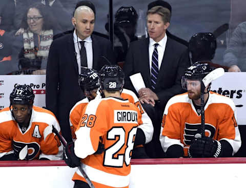 Jan 19, 2016; Philadelphia, PA, USA; Philadelphia Flyers assistant head coach Ian Laperriere (left) and head coach Dave Hakstol against the Toronto Maple Leafs during the third period at Wells Fargo Center. The Maple Leafs defeated the Flyers, 3-2. Mandatory Credit: Eric Hartline-USA TODAY Sports