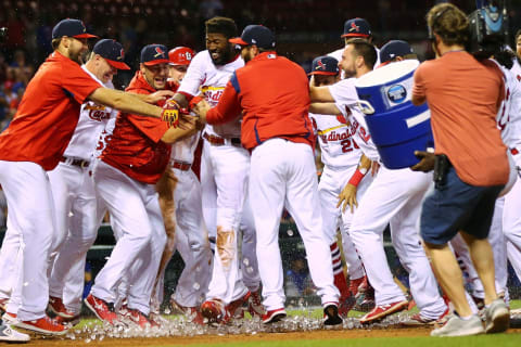 ST. LOUIS, MO – MAY 6: Dexter Fowler #25 of the St. Louis Cardinals is mobbed by his teammates after hitting a walk-off two-run home run in the fourteenth inning at Busch Stadium on May 6, 2018, in St. Louis, Missouri. (Photo by Dilip Vishwanat/Getty Images)