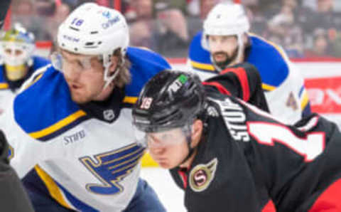 Feb 19, 2023; Ottawa, Ontario, CAN; St. Louis Blues center Robert Thomas (18) faces off against Ottawa Senators left wing Tim Stutzle (18) in the first period at the Canadian Tire Centre. Mandatory Credit: Marc DesRosiers-USA TODAY Sports