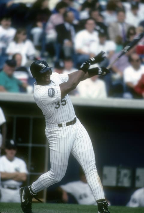 CHICAGO, IL – CIRCA 1991: First baseman Frank Thomas #35 of the Chicago White Sox swings and watches the flight of his ball during a Major League Baseball game circa 1991 at Comiskey Park in Chicago, Illinois. Thomas played for the White Sox from 1990 – 05. (Photo by Focus on Sport/Getty Images)