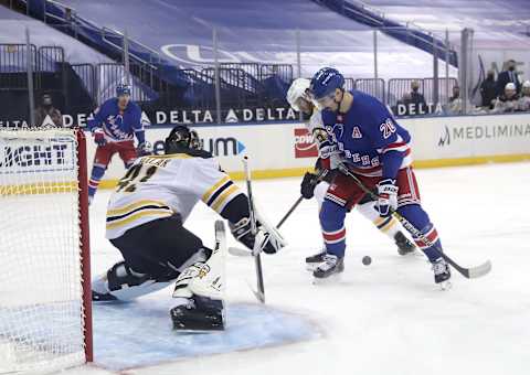 Jaroslav Halak #41 of the Boston Bruins defends his net as Chris Kreider #20 of the New York Rangers (Photo by Elsa/Getty Images)