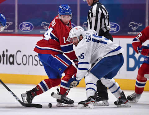 MONTREAL, QC – MAY 03: Nick Suzuki #14 of the Montreal Canadiens and Alexander Kerfoot #15 of the Toronto Maple Leafs  (Photo by Minas Panagiotakis/Getty Images)