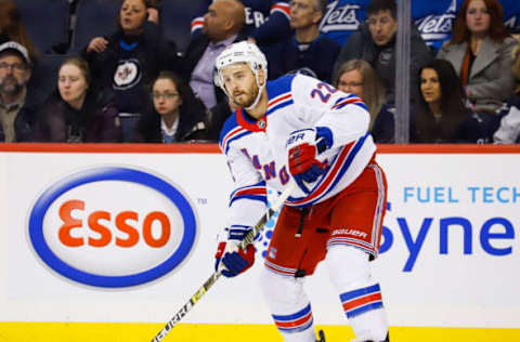 WINNIPEG, MB – FEBRUARY 12: Kevin Shattenkirk #22 of the New York Rangers plays the puck during first period action against the Winnipeg Jets at the Bell MTS Place on February 12, 2019 in Winnipeg, Manitoba, Canada. The Jets defeated the Rangers 4-3. (Photo by Darcy Finley/NHLI via Getty Images)