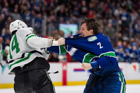 Apr 18, 2022; Vancouver, British Columbia, CAN; Dallas Stars forward Jamie Benn (14) fights with Vancouver Canucks defenseman Luke Schenn (2) in the second period at Rogers Arena. Mandatory Credit: Bob Frid-USA TODAY Sports