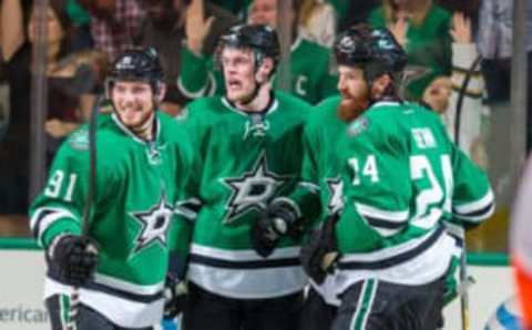 Oct 18, 2014; Dallas, TX, USA; Dallas Stars defenseman Kevin Connauton (23) and center Tyler Seguin (91) and defenseman Jordie Benn (24) and center Jason Spezza (90) celebrate a goal against the Philadelphia Flyers during the game at the American Airlines Center. The Flyers defeated the Stars 6-5 in overtime. Mandatory Credit: Jerome Miron-USA TODAY Sports