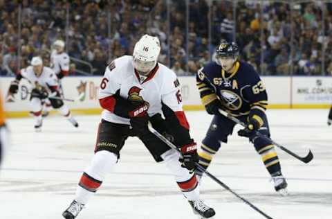 Oct 8, 2015; Buffalo, NY, USA; Ottawa Senators left wing Clarke MacArthur (16) takes a shot as Buffalo Sabres left wing Tyler Ennis (63) pursues during the first period at First Niagara Center. Mandatory Credit: Kevin Hoffman-USA TODAY Sports